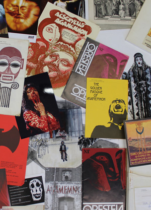 Photograph of numerous programme notes, flyers, and posters related to performances of Agamemnon and the Oresteia