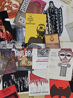 Photograph of a selection of the APGRD archive's programme notes, flyers and images relating to productions of Agamemnon and the Oresteia; photograph (c) APGRD