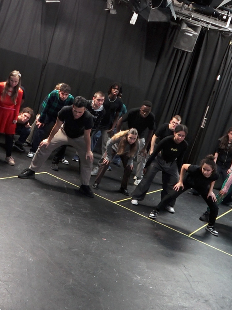 Student participants at a workshop in Chickenshed studio theatre